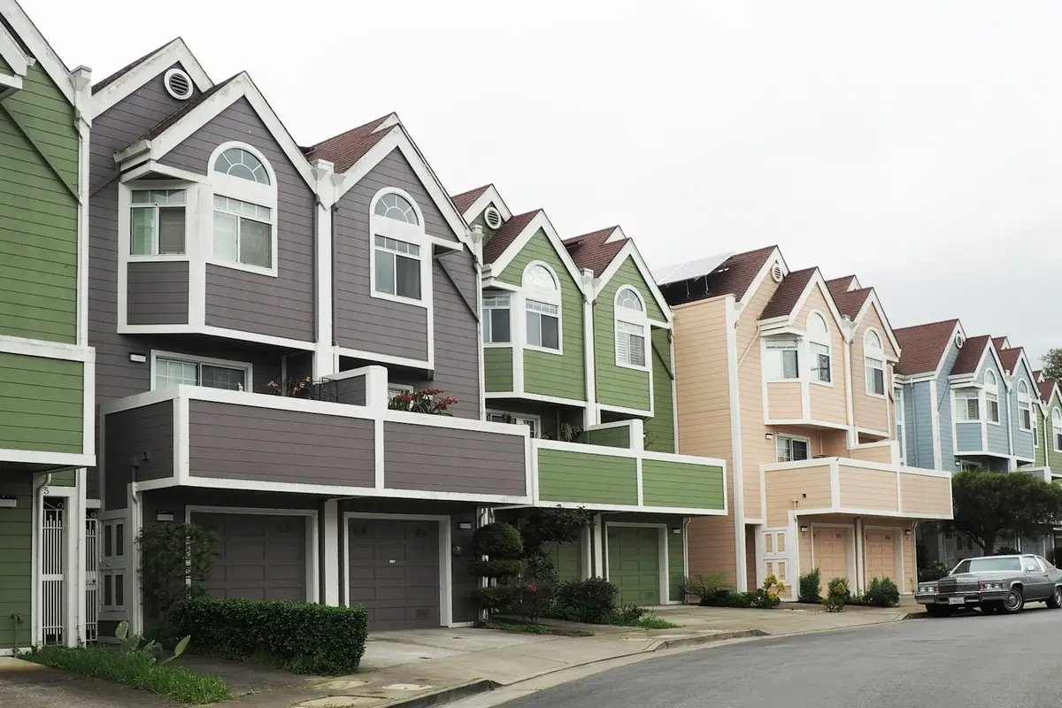 A row of colourful houses along a residential street