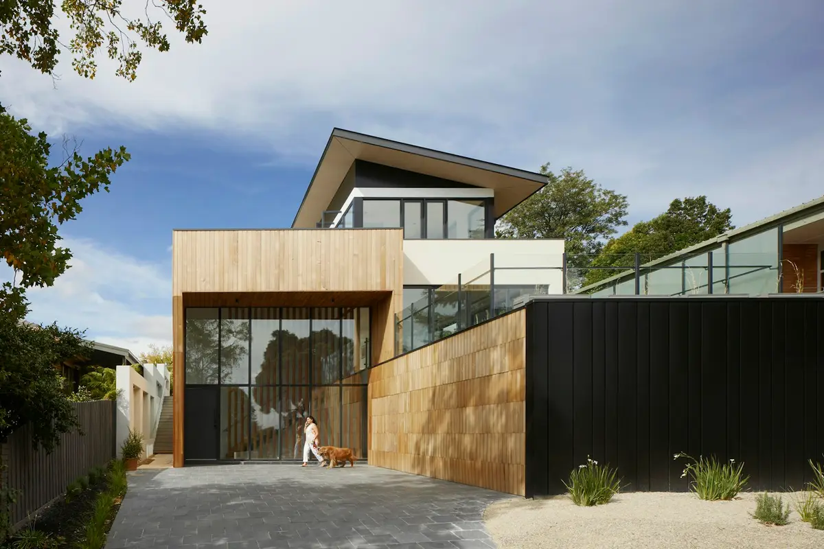 A modern house behind a wooden gate
