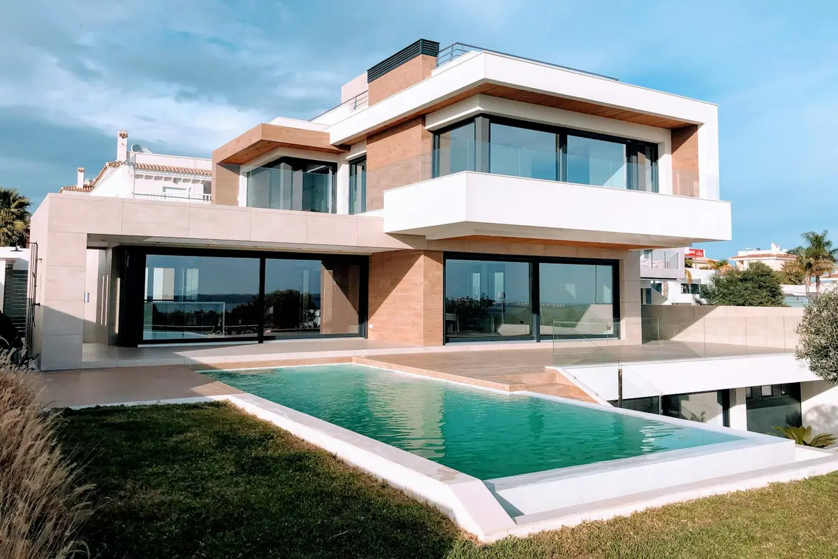 A modern two-storey house with large windows